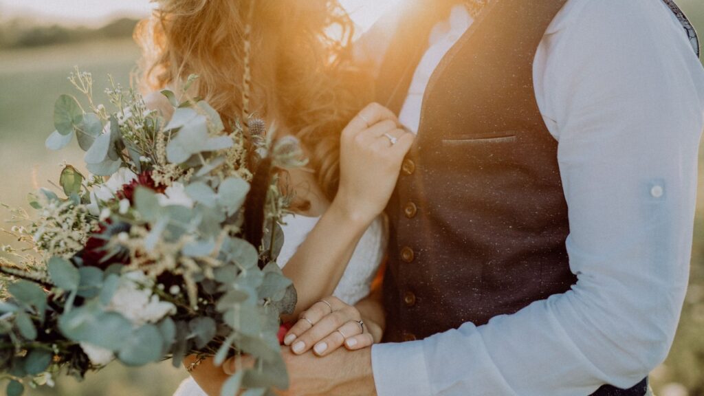 A couple embracing at their wedding